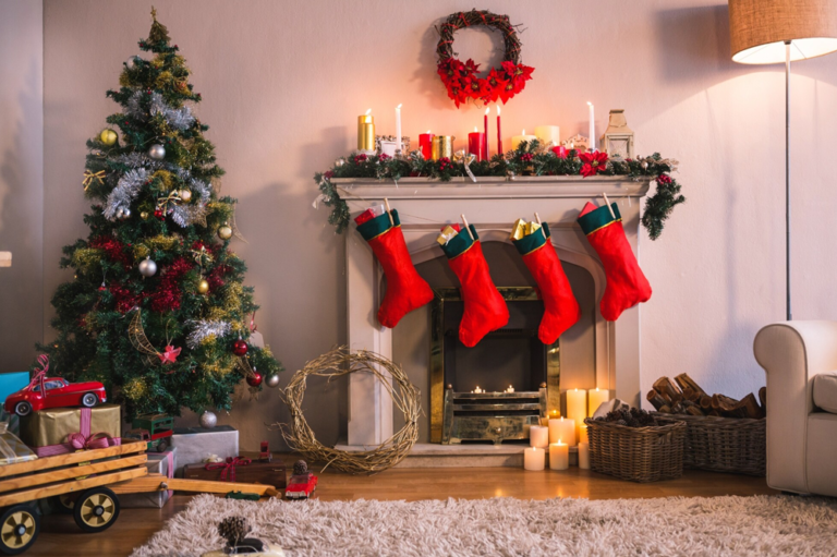 A cozy living room adorned for Christmas with a decorated tree, stockings hanging by the fireplace, and warm lighting creating a festive atmosphere.
