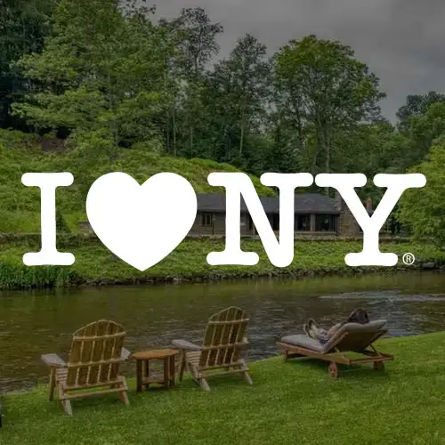A serene landscape featuring the "I ❤️ NY" logo with chairs by a river, surrounded by lush greenery and a calm atmosphere.