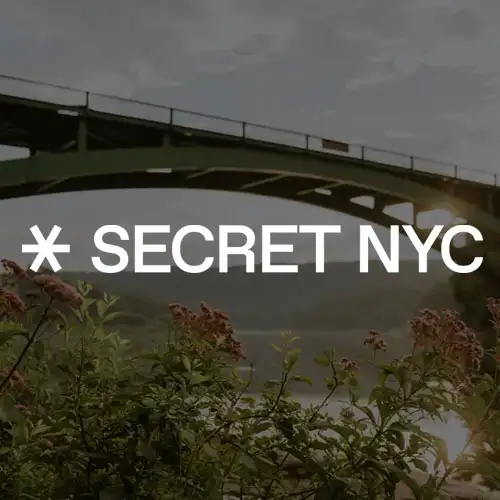 A scenic view of a bridge over water, surrounded by greenery and sunlight, with the text "SECRET NYC" prominently displayed.