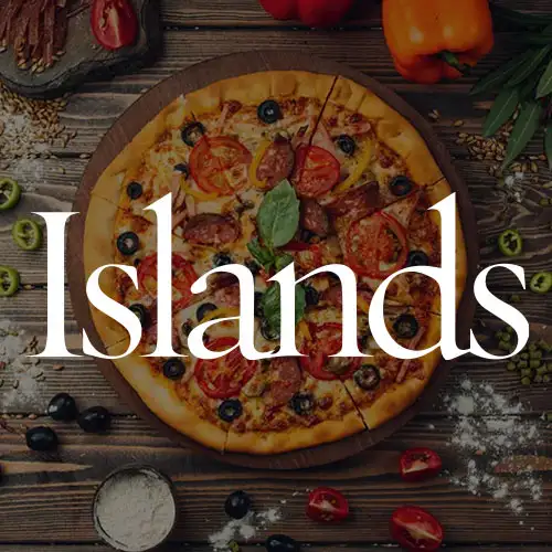 A delicious pizza topped with vegetables and herbs on a wooden table, surrounded by ingredients like olives and bell peppers.