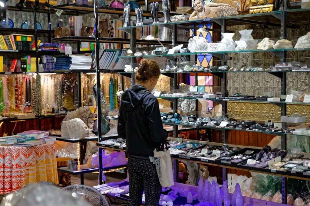 A woman browses goods in a gift shop and book store in the Sullivan Catskills. 