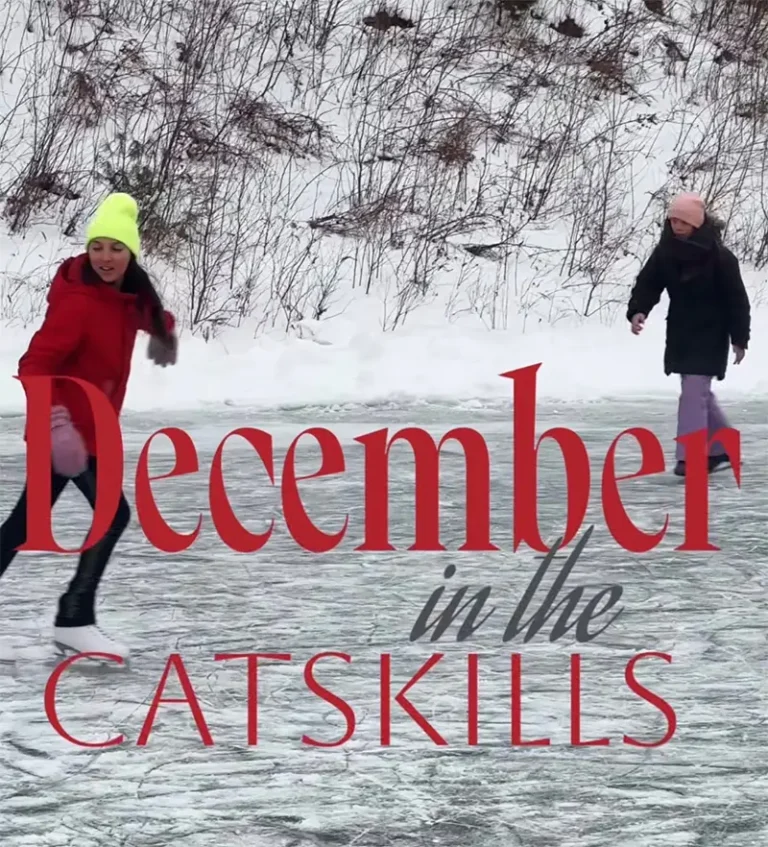 Two children ice skating on a frozen surface surrounded by snow, with text overlay reading 'December in the Catskills'.