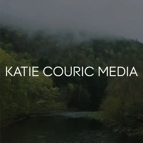 A serene landscape showcasing a river surrounded by lush greenery and misty mountains in the background.