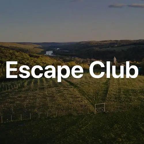A picturesque landscape featuring hills and a river, with the bold text 'Escape Club' overlaying the scene.