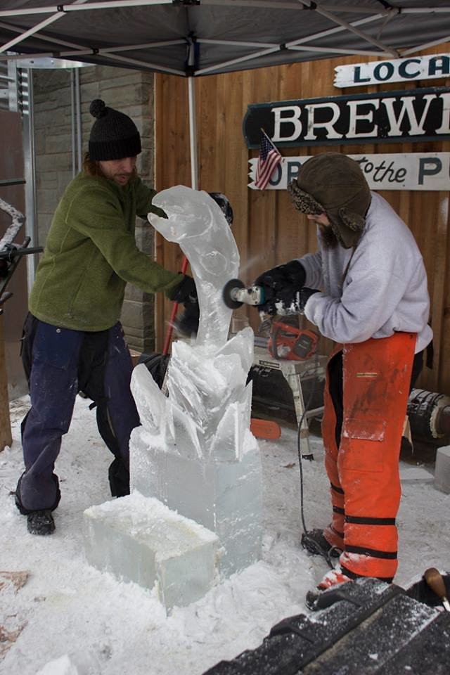 Ice carvers carve a trout statue of ice at the Roscoe Brewing Co. Winterfest. 