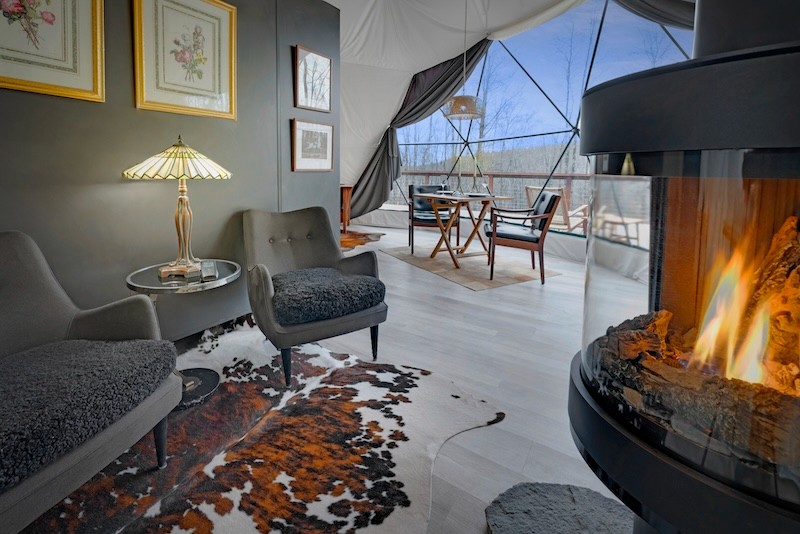 The Flagler dome interior with fireplace at Domes of Catskills. 