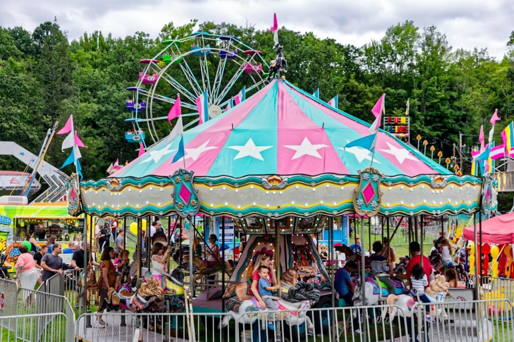 Merry-go-round, ferris wheel and other rides at the Grahamsville Little World's Fair. 