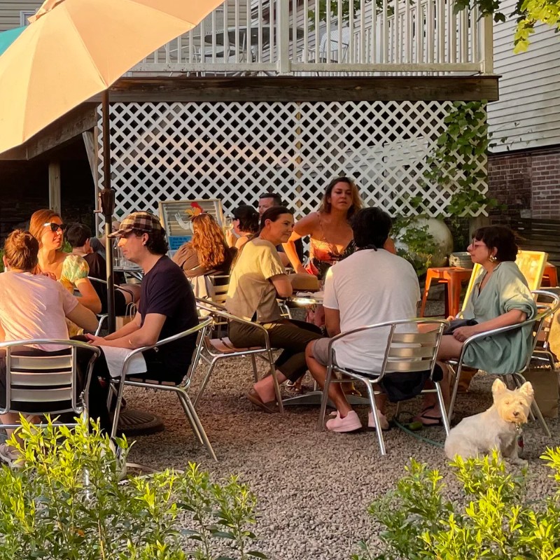 People wine tasting on the patio of the Callicoon Wine Merchant.
